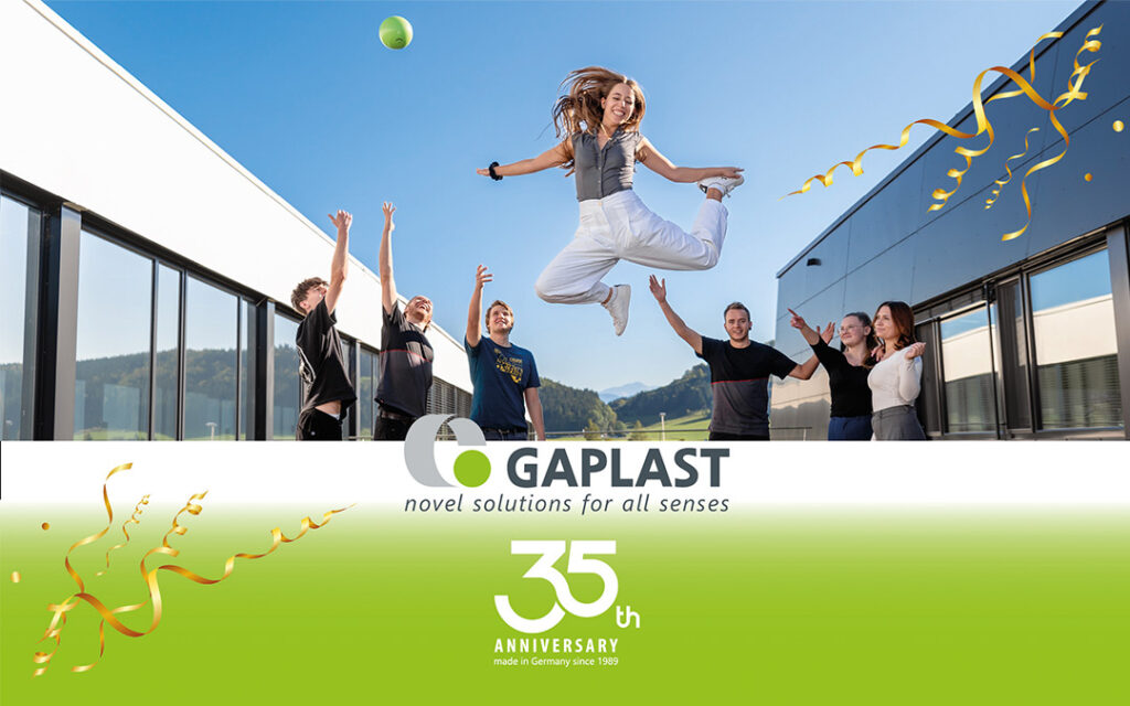 Gaplast News- cheers to 35 years Gaplast employee jumping surrounded by other employees celebrating 35th anniversary