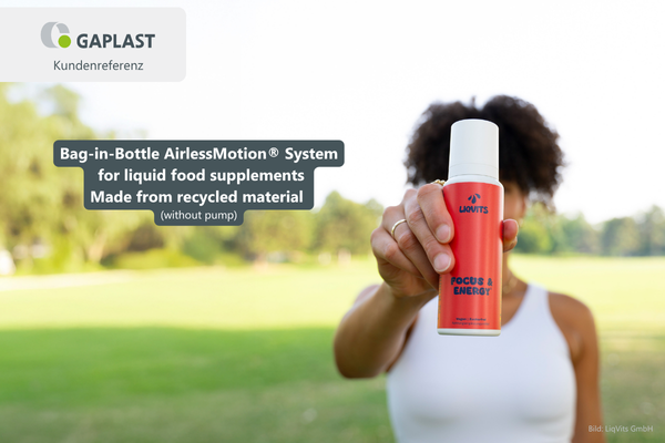 Person showing Liqvits product - a food supplement with AirlessMotion Bag-in-Bottle System made from recycled material