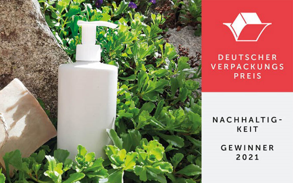 Gaplast News- German Packaging Award AirlessMotion bag-in-bottle partially made of PCR material in garden + logo of German packaging award