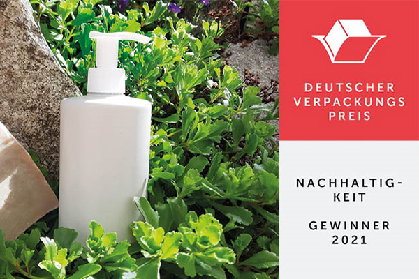 AirlessMotion PCR Flasche im Grünen + Logo Deutscher Verpackungspreis