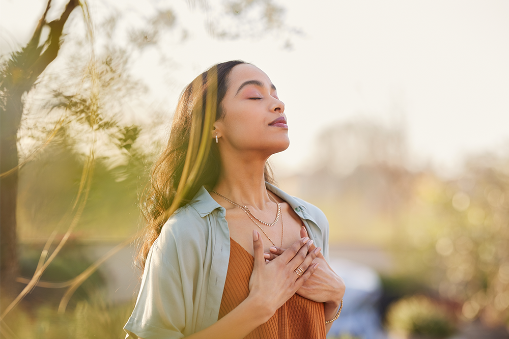 woman taking a deep breath